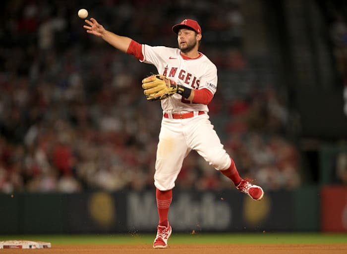 Jun 26, 2023; Anaheim, California, USA; Los Angeles Angels shortstop David Fletcher (22) throws Chicago White Sox center fielder Luis Robert Jr. (88) out at first in the eighth inning at Angel Stadium.
